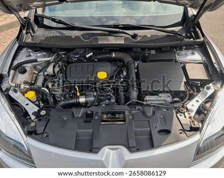 Discover this indepth exploration of a highperformance engine compartment, which showcases cuttingedge automotive technology and innovative design features within the vehicle
