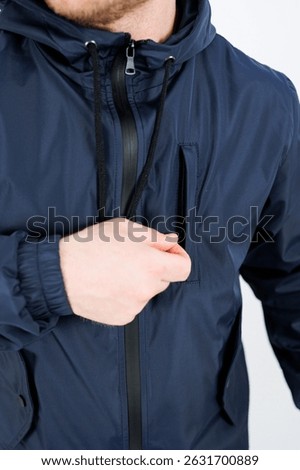 Discover this versatile navy jacket featuring a functional pocket, ideal for everyday wear, outdoor activities, and practical style. Stay comfortable and stylish.