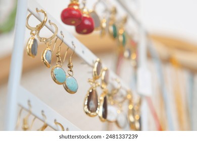 Discover a variety of colorful handmade earrings and beaded necklaces beautifully displayed - Powered by Shutterstock