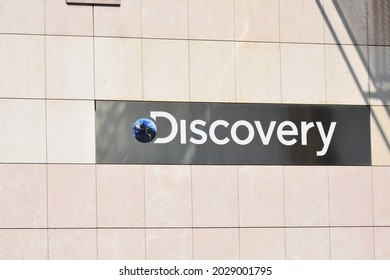 Discovery Channel Logo, Emblem, Sign, Signage On The Facade Of TV Station. WARSAW, POLAND - AUGUST 21, 2021