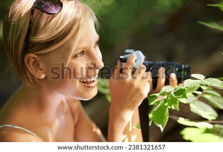 Discovery, photographer and nature with woman in forest for trees, environment and relax. Shooting, camera lens and photography with face of female person in woods for travel, tourism and summer