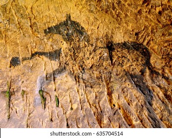 Discovery Of Prehistoric Paint Of Horse In Sandstone Cave. Spotlight Shines On Historical Human Painting. Black Carbon Horses On Sandstone Wall. Paint Of Hunting,  Prehistoric Picture