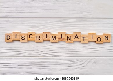 Discrimination Human Rights. Ageism, Sexism And Gomophobia Is Prejudicial Treatment Of Different Categories Of People. Wooden Cubes With Letters Isolated On Wooden Background.