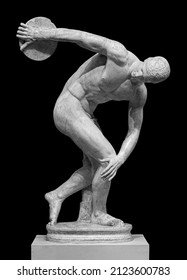 Discus Thrower Discobolus Statue. A Part Of The Ancient Olymp Games. A Roman Copy Of The Lost Bronze Greek Sculpture. Isolated On Black Background