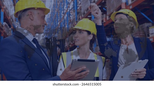 Discussing logistics, warehouse workers in hard hats with digital image overlay. teamwork, technology, planning, industrial, innovation, safety
