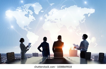 Discussing policy of international partnership. Mixed media - Shutterstock ID 1008869818