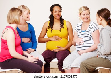 Discussing their hopes and dreams. A group of pregnant women sitting down together to share their feelings. - Powered by Shutterstock