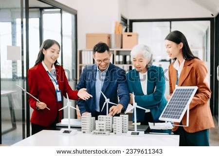 Discussion among businesspeople on the latest developments in solar cell panel technology and Solar Energy Environment city Concept.
