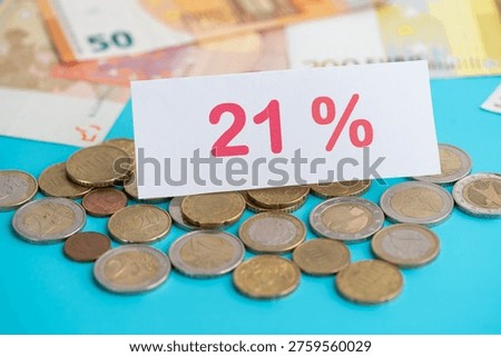 Discussion and evaluation of a planned VAT increase to 21 percent, sign 21% with euro money