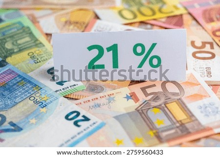 Discussion and evaluation of a planned VAT increase to 21 percent in Germany, sign with Euro money
