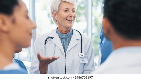 Discussion, medical and doctor with team of nurses in hospital for collaboration on diagnosis. Happy, conversation and cardiology mentor with healthcare students for feedback on internship in clinic. - Powered by Shutterstock