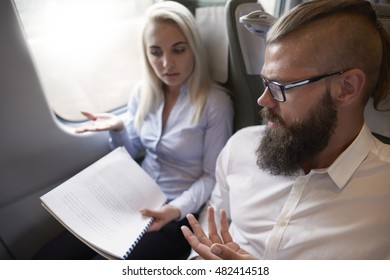 Discussion over documents at the train