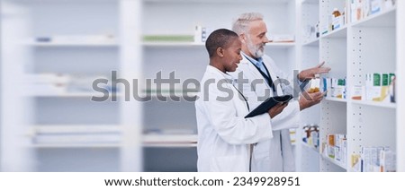 Discussion, tablet and pharmacists checking medication for inventory, stock or medical research. Healthcare, medicine and senior chemist mentor teaching female pharmaceutical student with technology.
