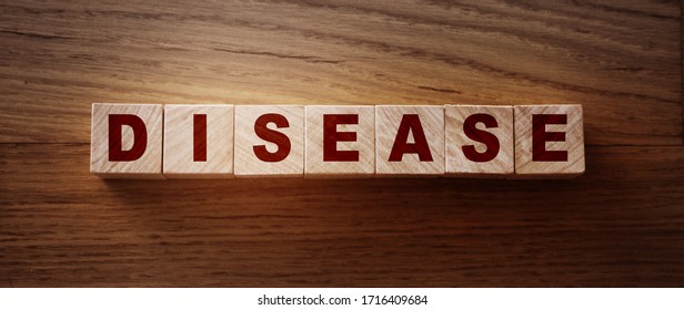 Disease Word Written In Wooden Cubes. Medicine healthcare concept. - Shutterstock ID 1716409684