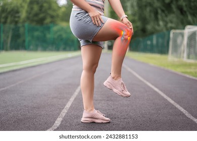 Diseases of the knee joint, bone fracture and inflammation, athletic woman on a running track after workout suffering from pain in her leg, healthy lifestyle concept - Powered by Shutterstock