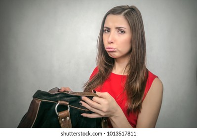 Disgruntled Girl Forgot Her Wallet With The Money At Home. Not Enough Money For Shopping. The Lost Wallet Concept.