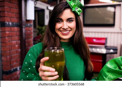 Disguised Woman Holding A Green Pint For St Patricks Day