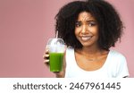 Disgust, nutrition and woman with green juice for detox, health or wellness weight loss diet. Gross, unhappy and female person drinking organic smoothie for vitamins isolated by studio background.