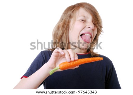 disgusted boy with a carrot