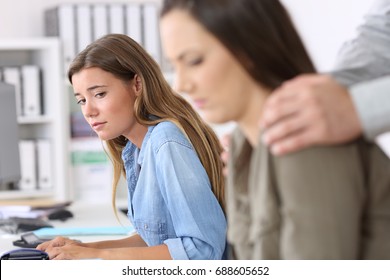Disgusted employee being victim of harassment and a colleague watching her