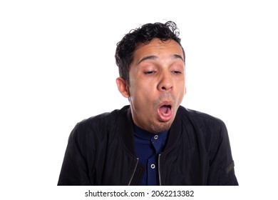 Disgusted Man Retching With Vomit. White Background. Young Adult Latin Young Man About To Vomit From Disgust. Face Expressions.