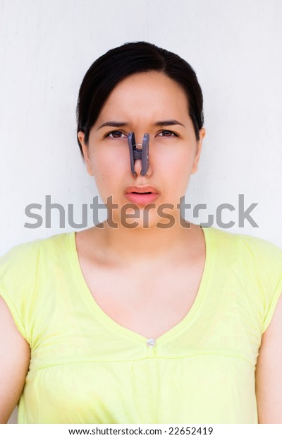 Disgusted Woman Clothespin Clipped Nose Royalty Free Stock Image