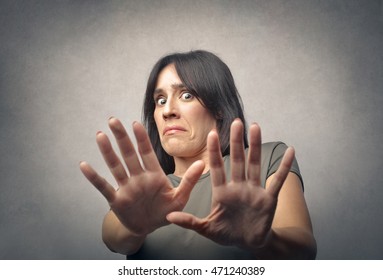 Disgusted Woman Pushing Away Someone