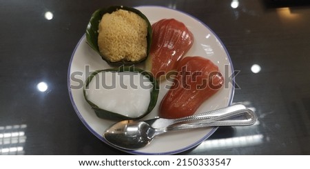 Close​ up​ Asian​ dessert​s​ and​ Rose​ a​pple​ pieces​ on​ white​ ceramic​ dish