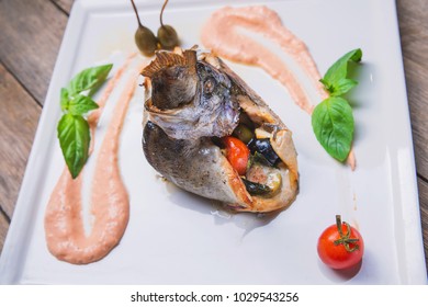 A Dish Of Baked Flounder Stuffed With Vegetables