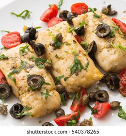 Dish Of Boiled Cod Fish With Black Olives, Capers And Tomatoes, Mediterranean Cuisine 