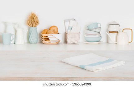 Dish Cloth On Wooden Table Over Defocused Kitchen Counter Background