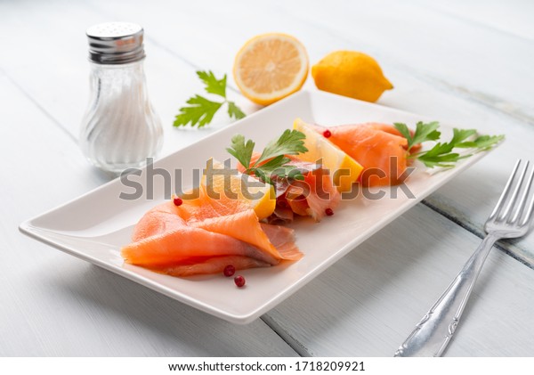 Dish of delicious\
sliced smoked salmon