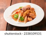 Dish of delicious spaghetti with scampi sauce, italian food 