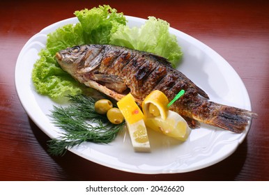 Dish With Fish By A Carp