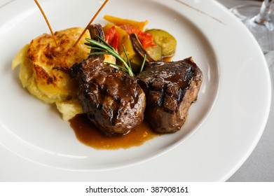 A Dish Of Lamb Steak With Rosemary And Smash Potato.