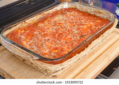 Dish of Parmigiana Eggplant with bread in a Pyrex