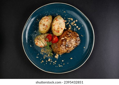 dish in a plate on a black background for a restaurant - Shutterstock ID 2395432851