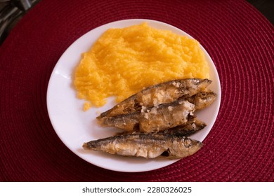 Dish plate of traditional fried fish with polenta food - Shutterstock ID 2280326025