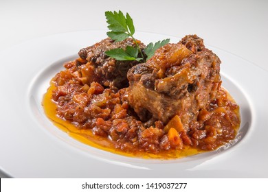 Dish With Portion Of Oxtail Stewed Vaccinara With Parsley