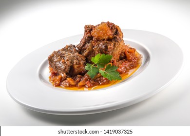 Dish With Portion Of Oxtail Stewed Vaccinara With Parsley