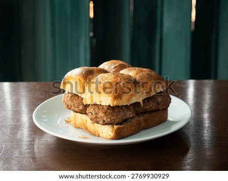 dish of pull apart burger bun with meat patty