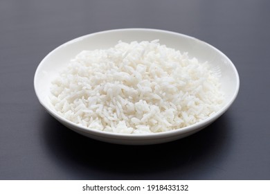 Dish Of Rice On Dark Background.