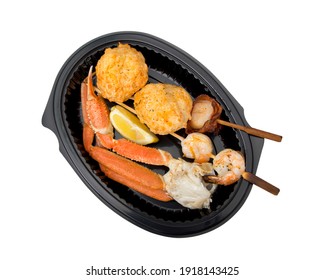 Dish Of Seafood Including Crab Leg, Scallop, Shrimpand Crab Cake Isolated On White Background