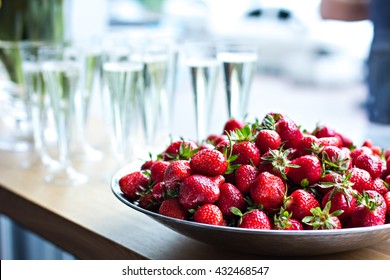 Dish With Strawberries And Champagne Glasses On The Table. Dinner, Party, Bachelorette Party, Summer Party, Celebration.