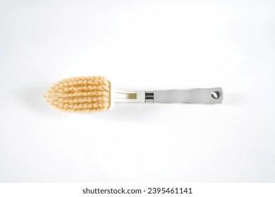dish washing brush isolated on white background - Shutterstock ID 2395461141