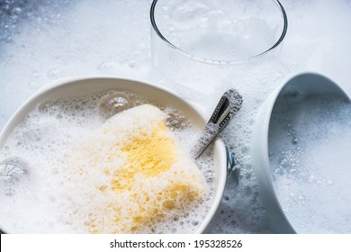 Dish Washing. Soaking In The Kitchen Sink