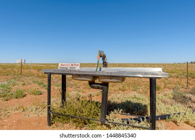 A Dish Washing Station At A Camp Site In An Australian Desert.