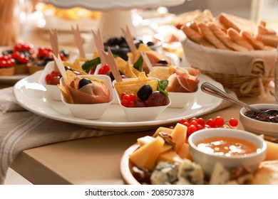 Dishes with different food on table indoors. Luxury brunch