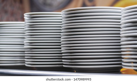 Dishes Stacked White On Shelf In Restaurant