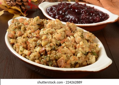 Dishes Of Turkey Stuffing And Chunky Cranberry Sauce